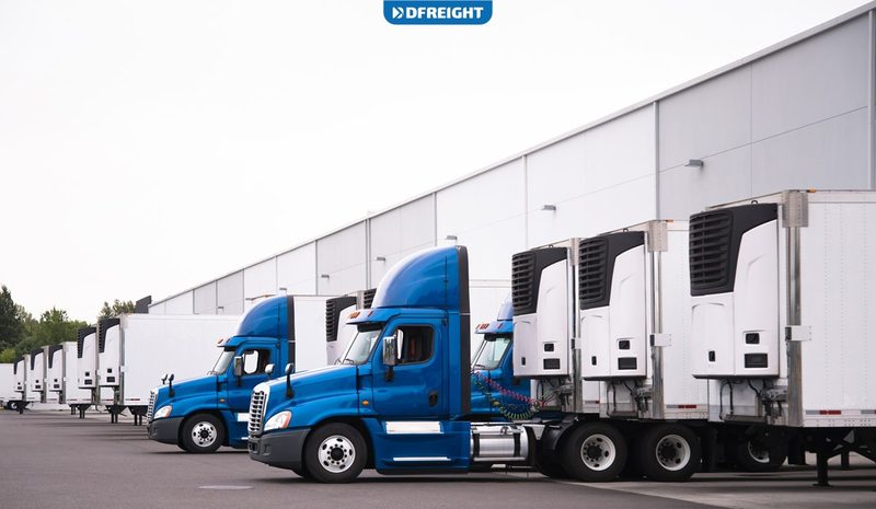 White refrigerated reefer trailer truck on the road